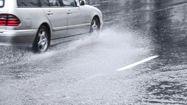 stock image of car driving through heavy rain 136392769938903901 140818150138 orange warning