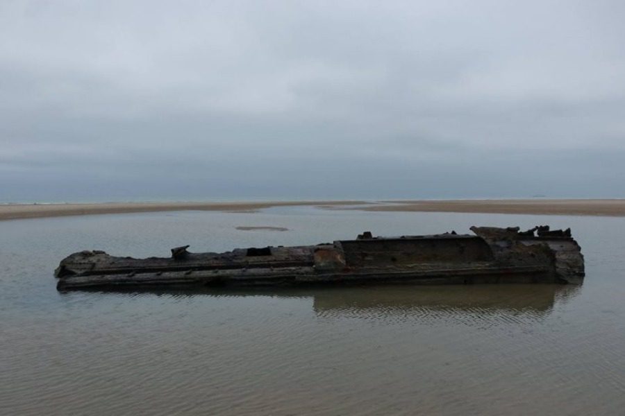 German submarine of World War I emerges on a beach in France