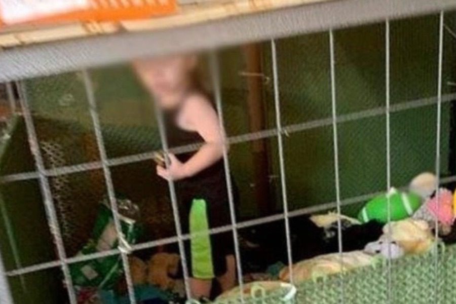 Police found a child in an iron cage between snakes and mice