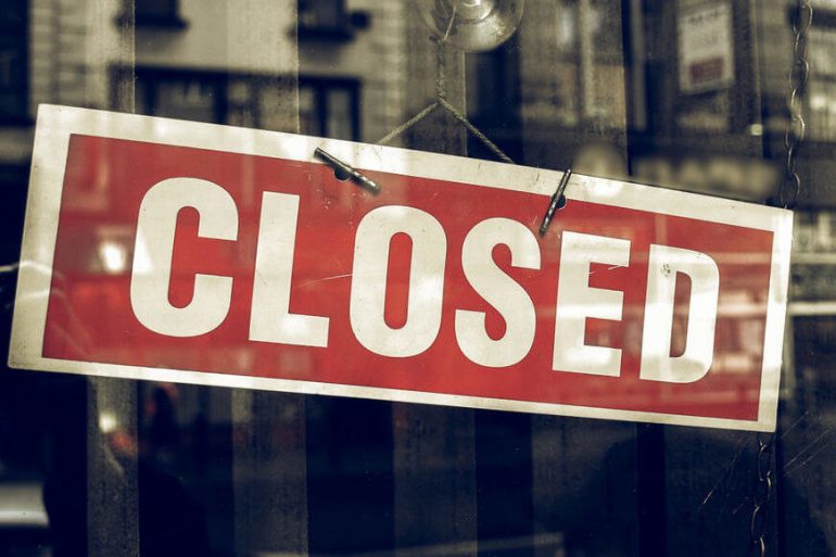 closed sign hotel door due to covid lockdown Coronavirus
