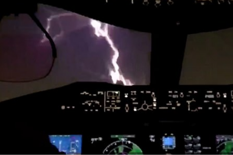 The moment lightning strikes the nose of an airplane as it prepares to land