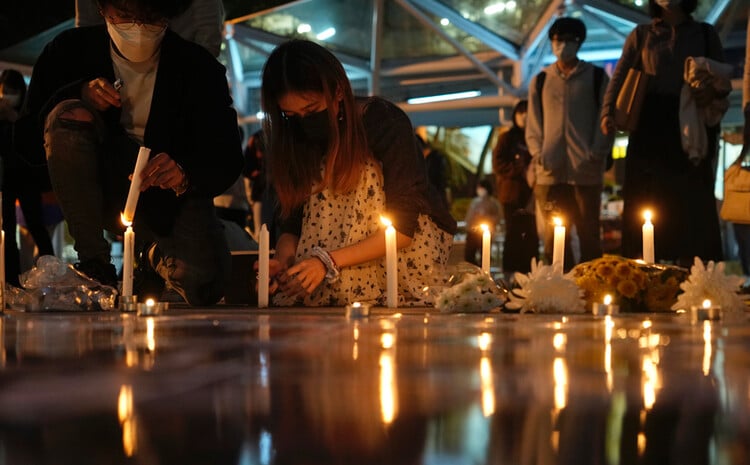 Students in Hong Kong light candles