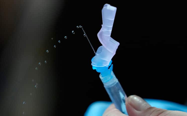 Needle with coronavirus vaccine