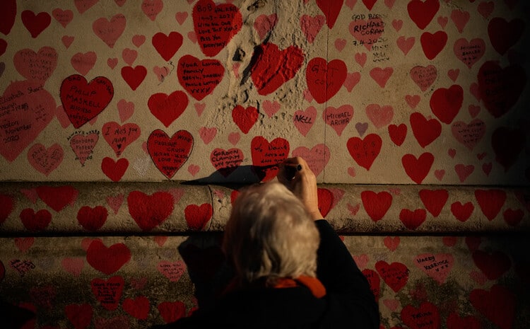 Woman writing message on wall