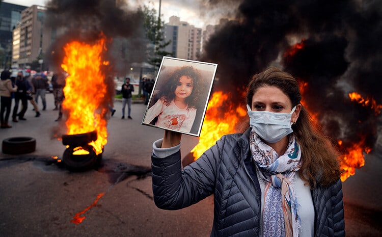 Woman with photo of a girl in Lebanon
