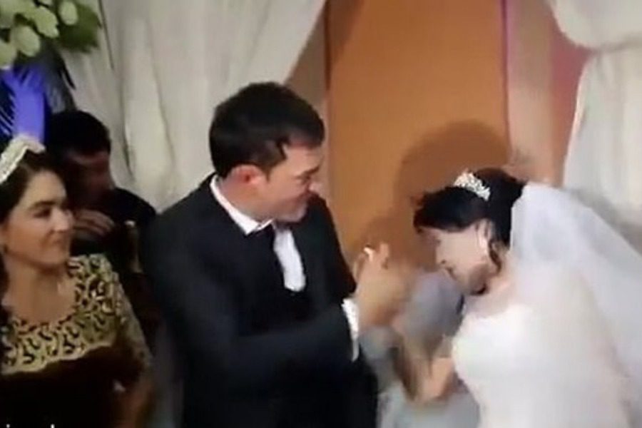 Disgust: Groom slaps the bride hard for her innocent teasing with a little cake