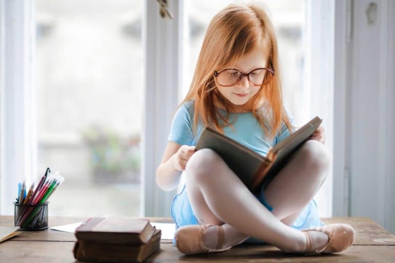 girl red hair reading book pexels andrea piacquadio public domain Child